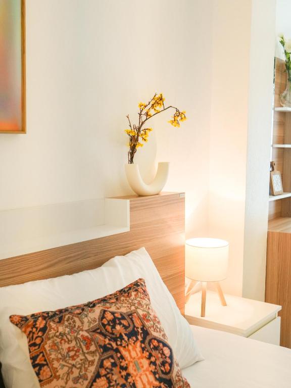 Postel nebo postele na pokoji v ubytování Place Hotel