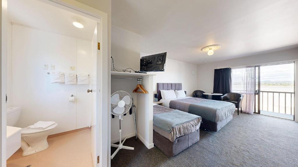 Postel nebo postele na pokoji v ubytování Albatross Motel