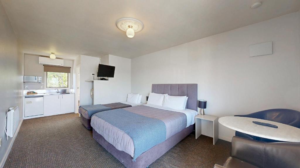 Postel nebo postele na pokoji v ubytování Albatross Motel
