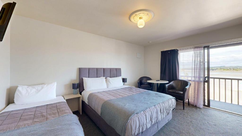 Postel nebo postele na pokoji v ubytování Albatross Motel