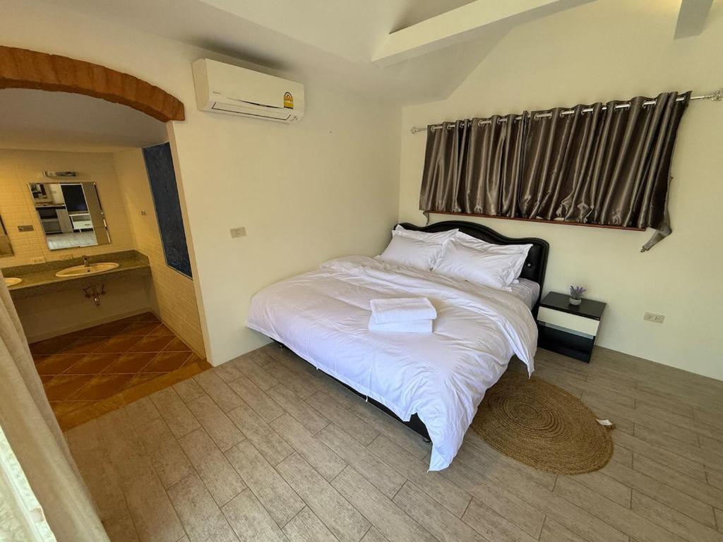 Postel nebo postele na pokoji v ubytování G warmth Pool Villa