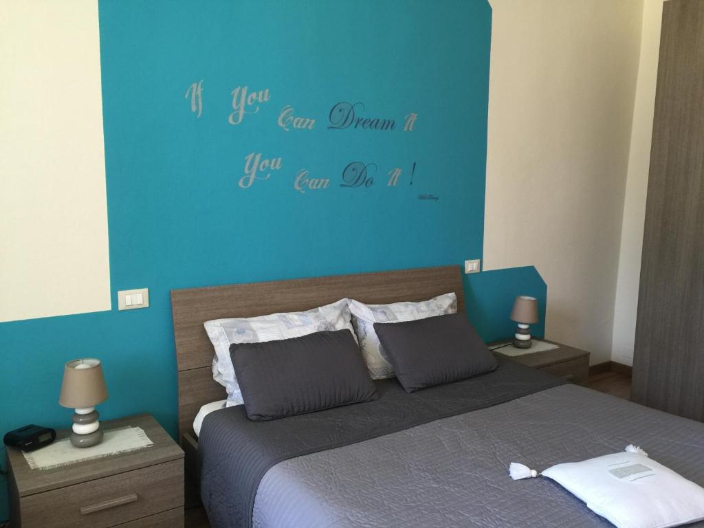 Posteľ alebo postele v izbe v ubytovaní L'Iris B&B