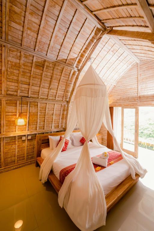 Ένα ή περισσότερα κρεβάτια σε δωμάτιο στο Sunrise Villa Penida
