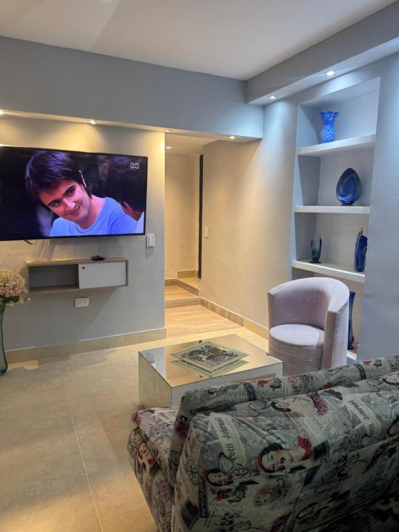 TV a/nebo společenská místnost v ubytování Apartaestudio altos de riomar