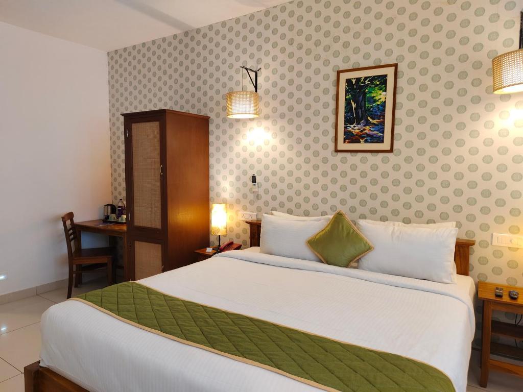 Postel nebo postele na pokoji v ubytování Hotel Aura by Woco Stays