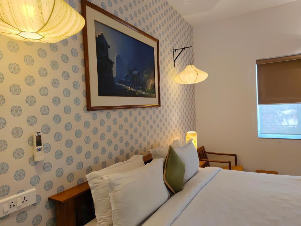 Postel nebo postele na pokoji v ubytování Hotel Aura by Woco Stays