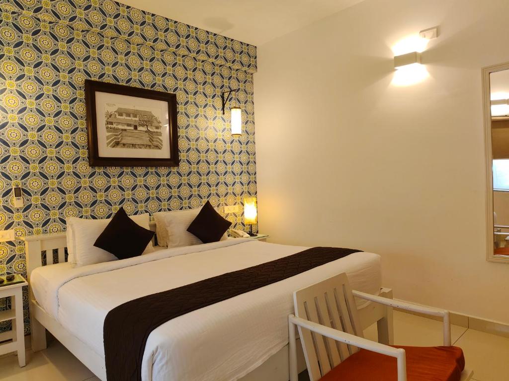 Postel nebo postele na pokoji v ubytování Hotel Aura by Woco Stays