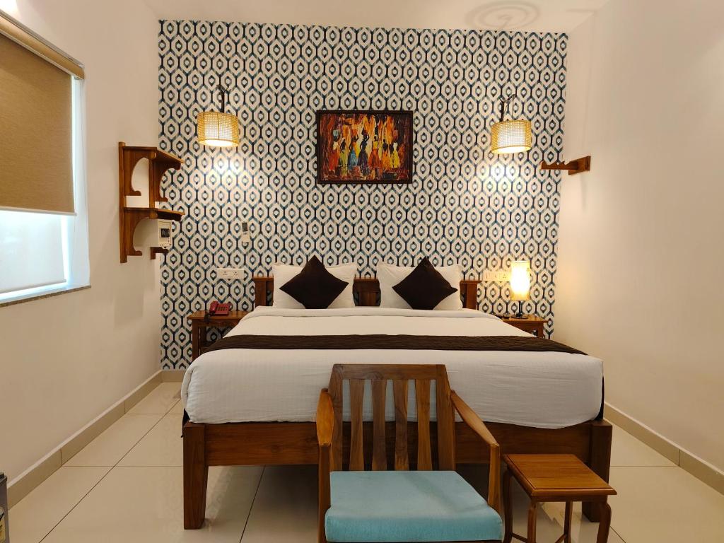 Postel nebo postele na pokoji v ubytování Hotel Aura by Woco Stays