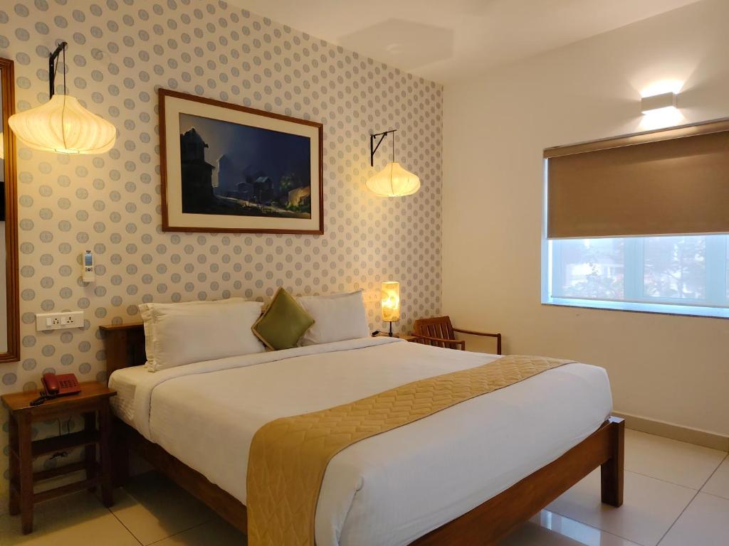 Postel nebo postele na pokoji v ubytování Hotel Aura by Woco Stays