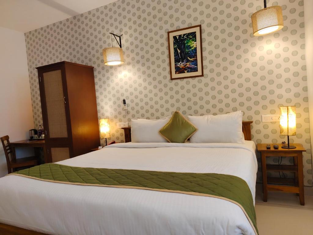 Postel nebo postele na pokoji v ubytování Hotel Aura by Woco Stays