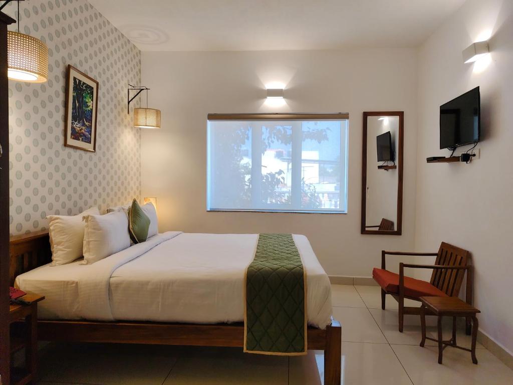 Postel nebo postele na pokoji v ubytování Hotel Aura by Woco Stays