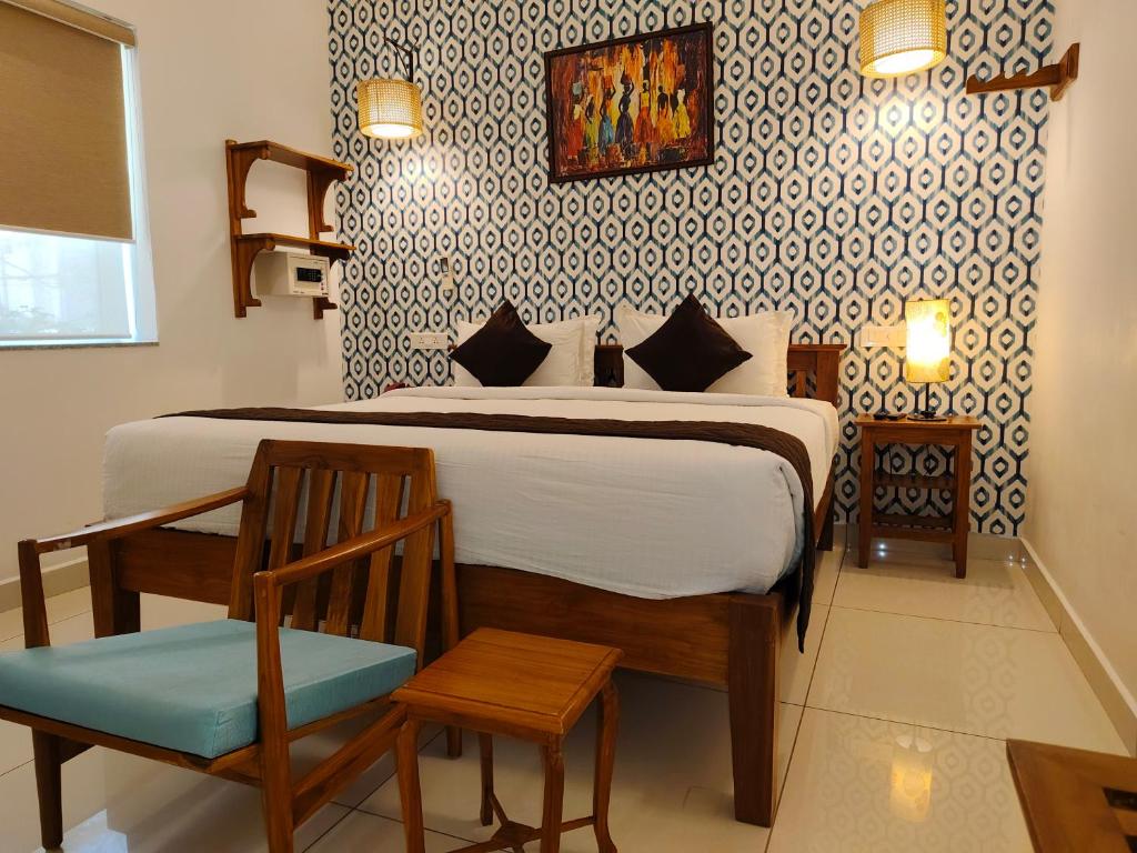 Postel nebo postele na pokoji v ubytování Hotel Aura by Woco Stays