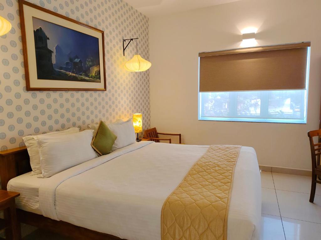 Postel nebo postele na pokoji v ubytování Hotel Aura by Woco Stays