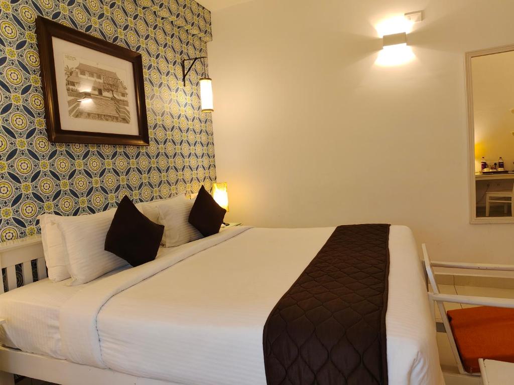 Postel nebo postele na pokoji v ubytování Hotel Aura by Woco Stays