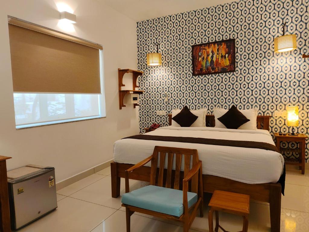 Postel nebo postele na pokoji v ubytování Hotel Aura by Woco Stays