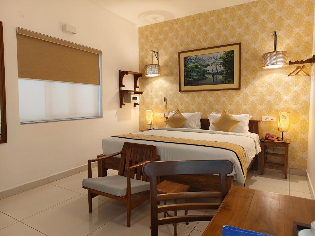 Postel nebo postele na pokoji v ubytování Hotel Aura by Woco Stays