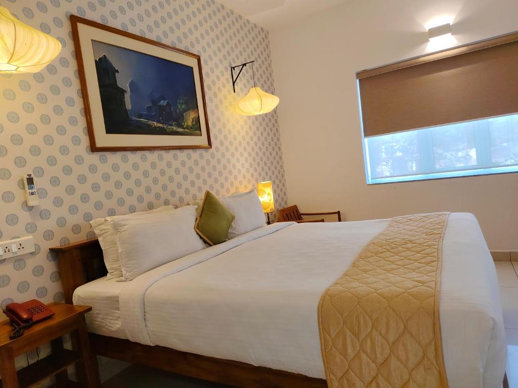 Postel nebo postele na pokoji v ubytování Hotel Aura by Woco Stays