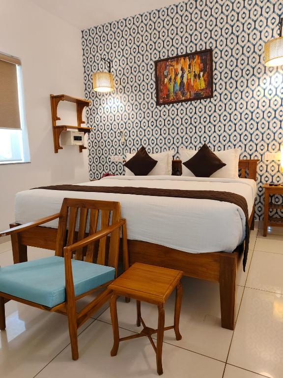 Postel nebo postele na pokoji v ubytování Hotel Aura by Woco Stays
