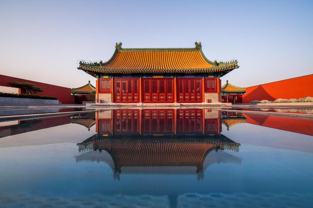 a building on a pool of water in a building at base-Beijing Wangfujing Serviced Apartment- in Hutong &Bike rental &Close to Forbidden City, Tian'anmen Square &Subway nearby &Free coffee &Washing machine,Kitchen &Restaurant discount &English speaking &High speed free WiFi in Beijing