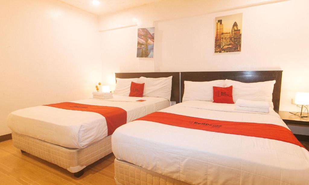 Postel nebo postele na pokoji v ubytování RedDoorz at City Stay Inns Marilao