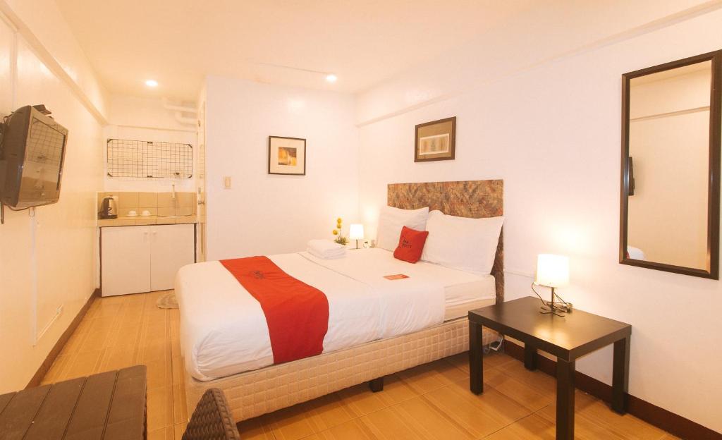 Postel nebo postele na pokoji v ubytování RedDoorz at City Stay Inns Marilao