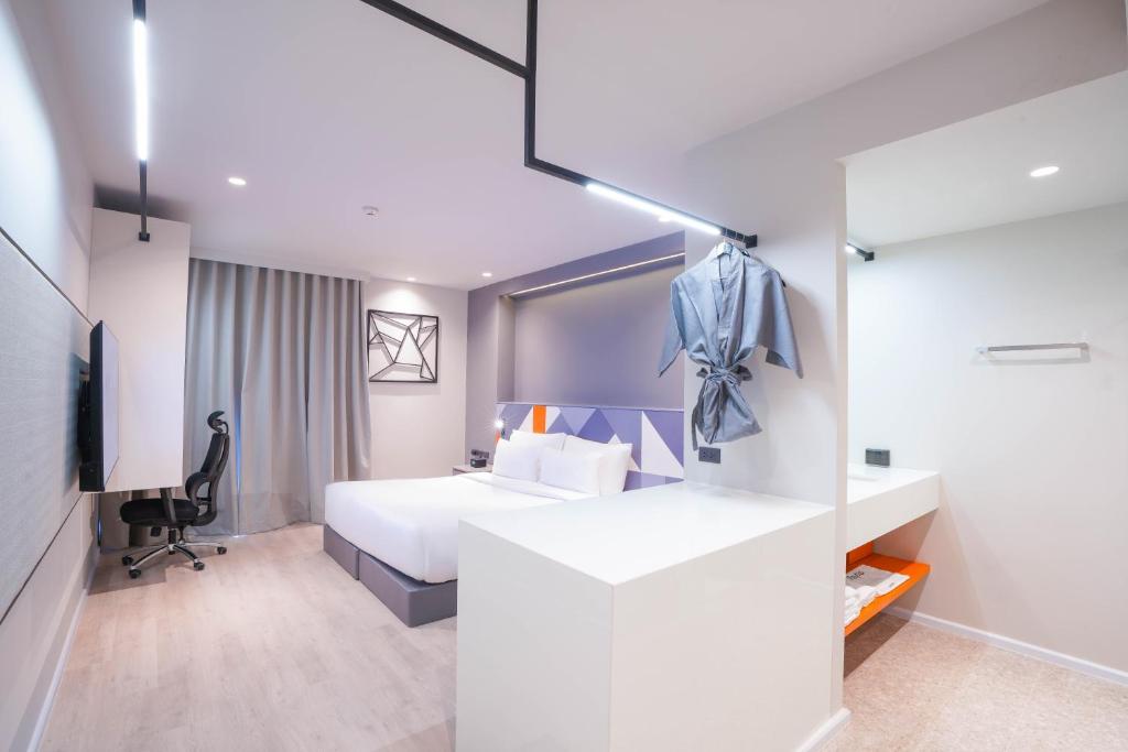 Postel nebo postele na pokoji v ubytování Maybis Hotel
