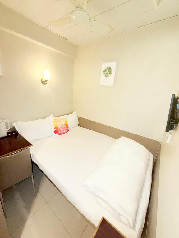 Postel nebo postele na pokoji v ubytování 吉祥賓館 Fortune Inn