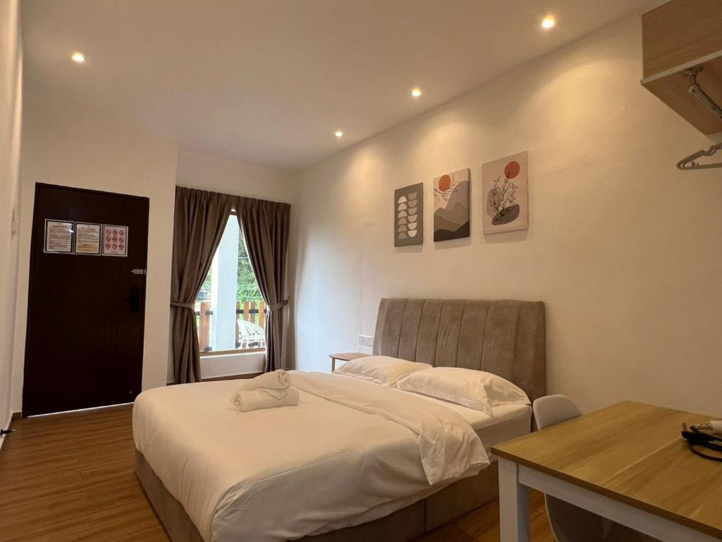 Postel nebo postele na pokoji v ubytování Hillview Ipoh
