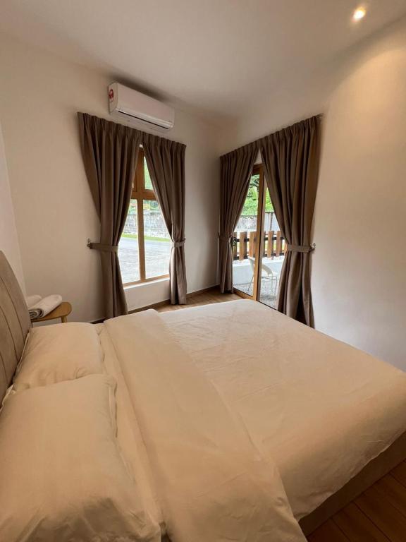 Postel nebo postele na pokoji v ubytování Hillview Ipoh