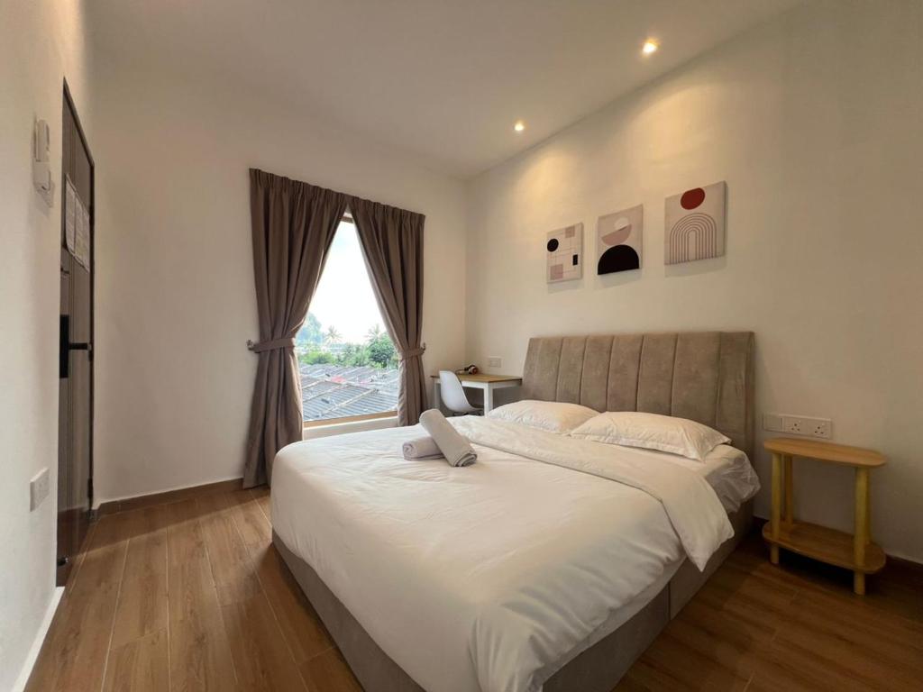 Postel nebo postele na pokoji v ubytování Hillview Ipoh