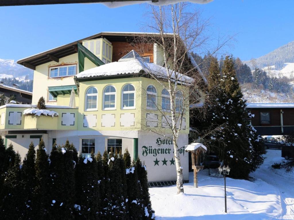 a building with snow on it in the snow at Apartment in Fügen near Spieljoch Ski Lift in Fügen