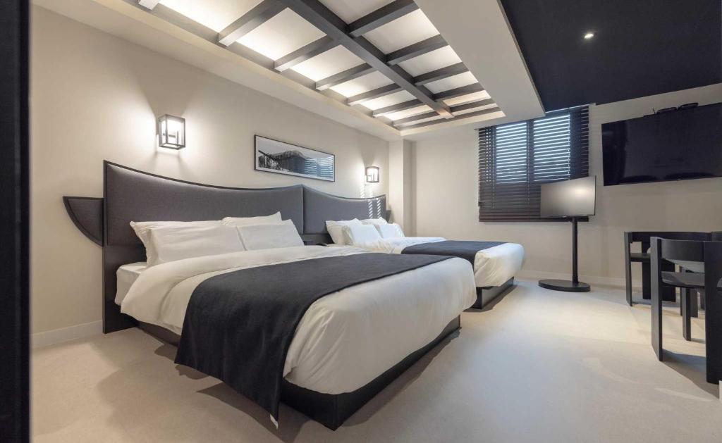 Postel nebo postele na pokoji v ubytování Aank Hotel and Spa Jongno Unni