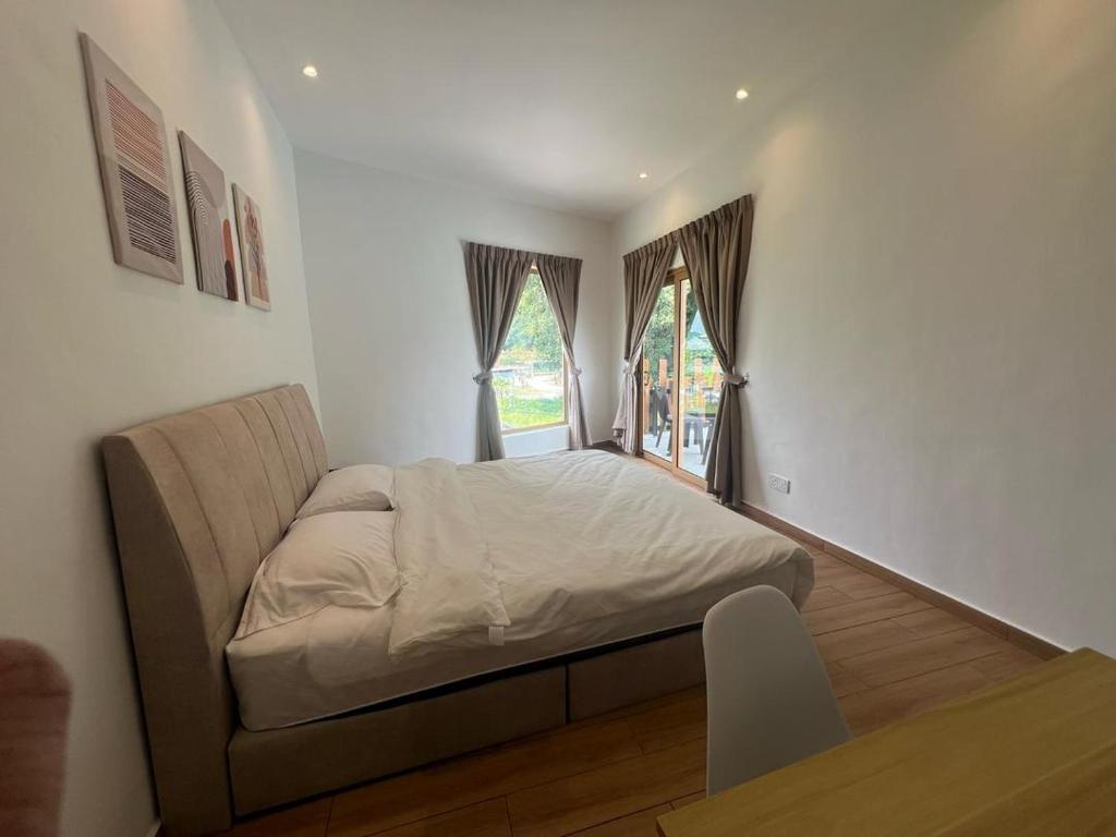 Postel nebo postele na pokoji v ubytování Hillview Ipoh