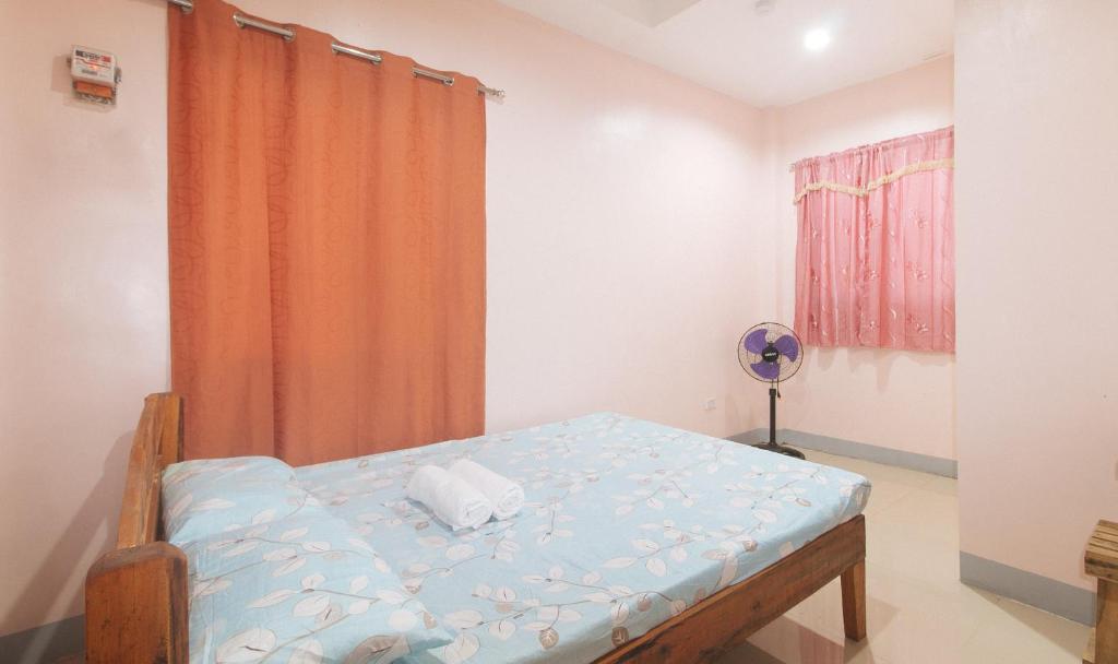 Postel nebo postele na pokoji v ubytování Bello Vue Apartelle