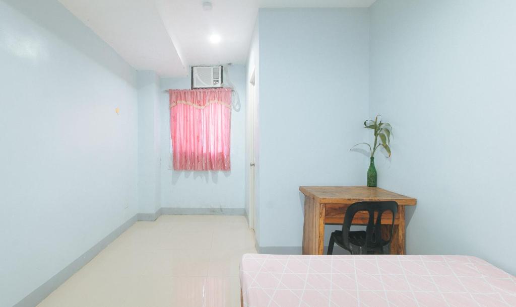 Postel nebo postele na pokoji v ubytování Bello Vue Apartelle