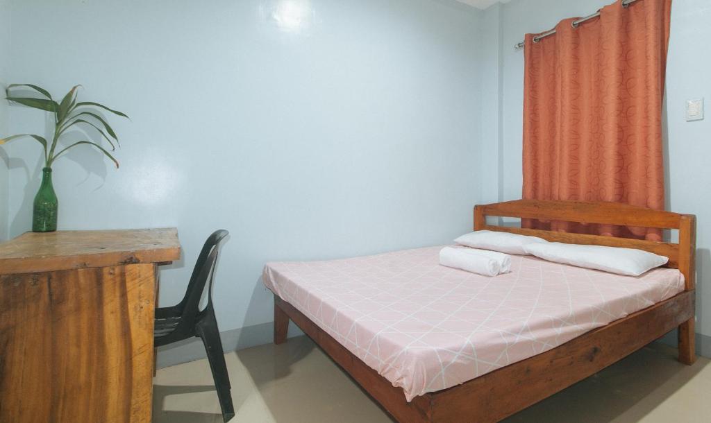 Postel nebo postele na pokoji v ubytování Bello Vue Apartelle