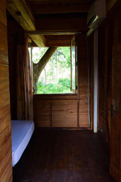 Postel nebo postele na pokoji v ubytování Wilpattu Tree House