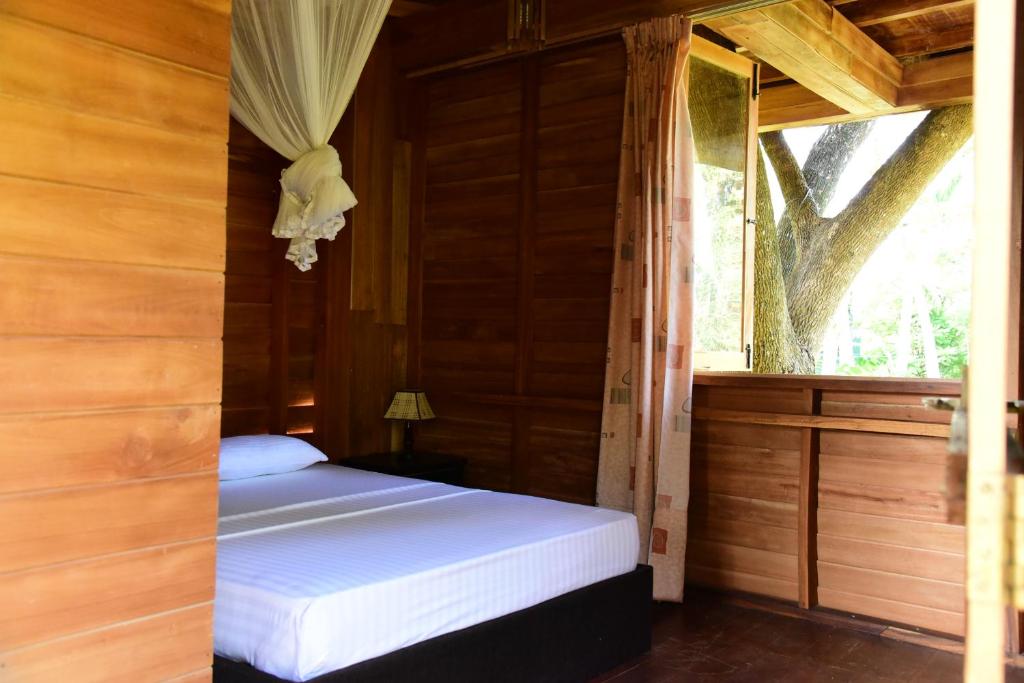 Postel nebo postele na pokoji v ubytování Wilpattu Tree House