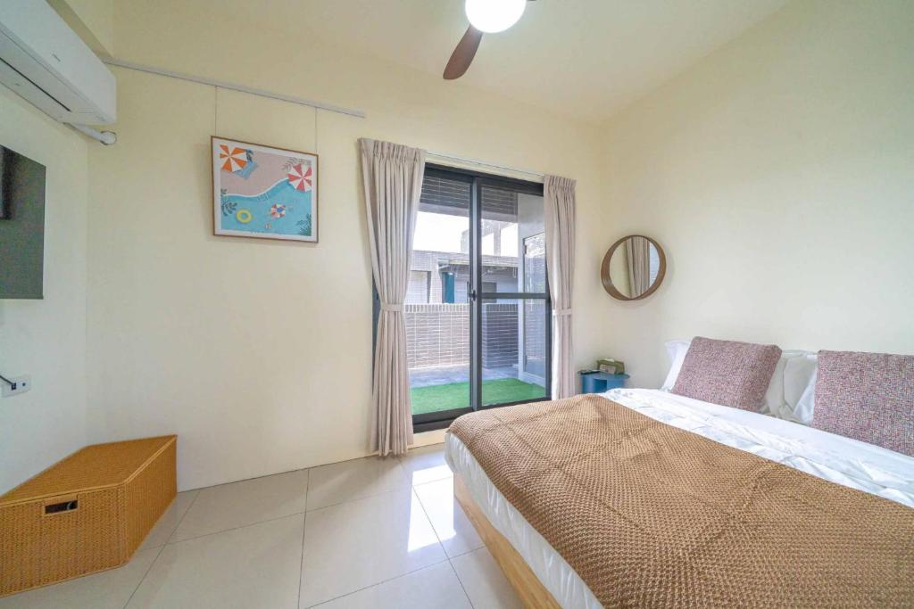 Postel nebo postele na pokoji v ubytování Lihao B&B