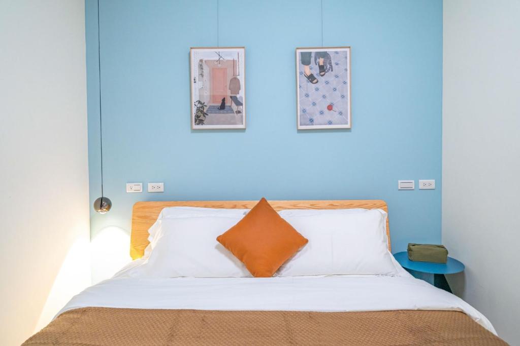 Postel nebo postele na pokoji v ubytování Lihao B&B