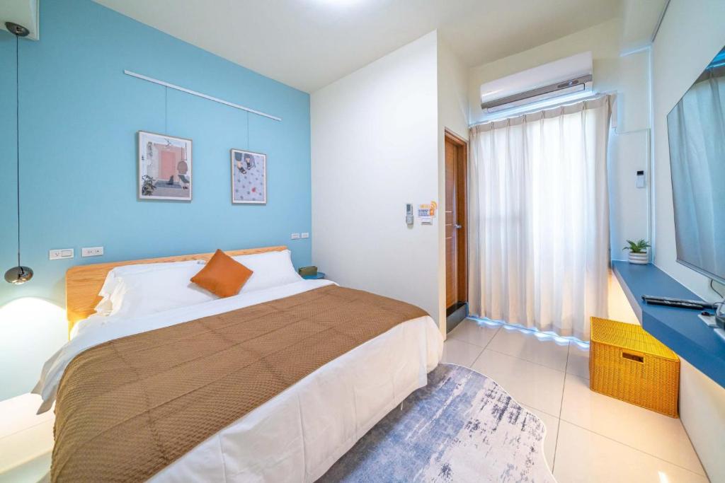 Postel nebo postele na pokoji v ubytování Lihao B&B