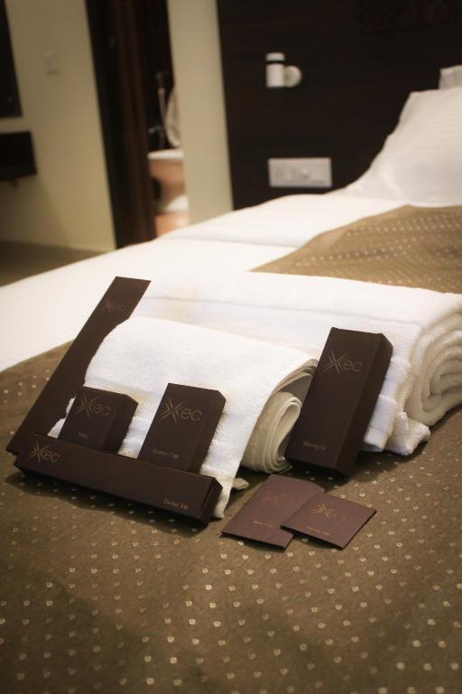 Postel nebo postele na pokoji v ubytování Hotel Xec Residency
