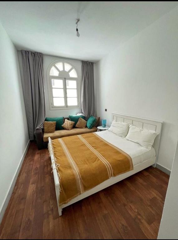 Postel nebo postele na pokoji v ubytování Apartment next to the beach