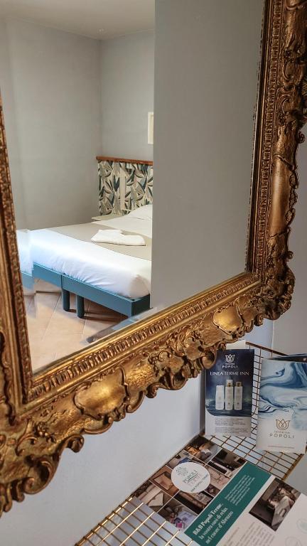 Postel nebo postele na pokoji v ubytování B&B Popoli Terme