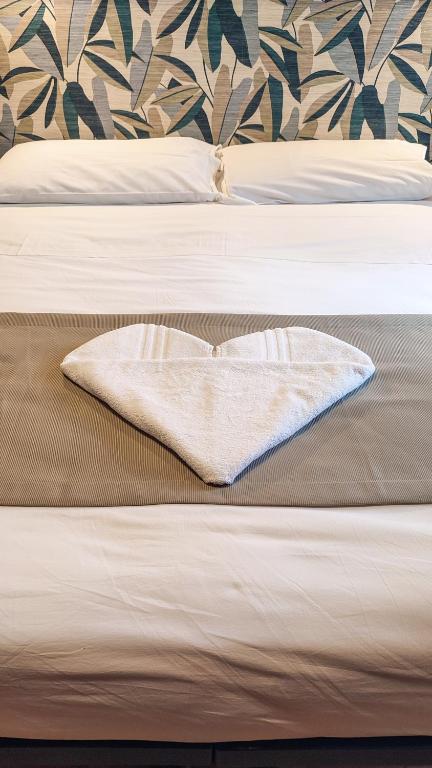 Postel nebo postele na pokoji v ubytování B&B Popoli Terme