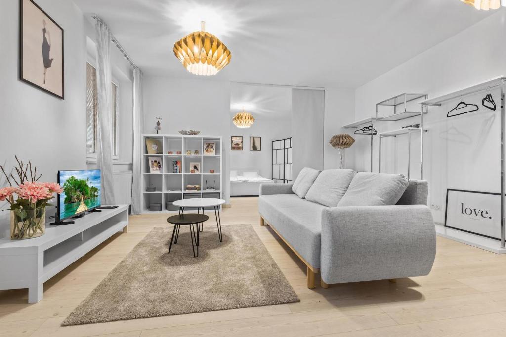 a living room with a couch and a table at AH Bosakova Elegant in Bratislava