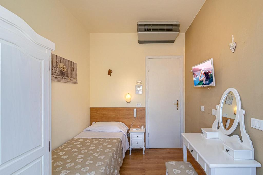 Postel nebo postele na pokoji v ubytování Hotel Mariani