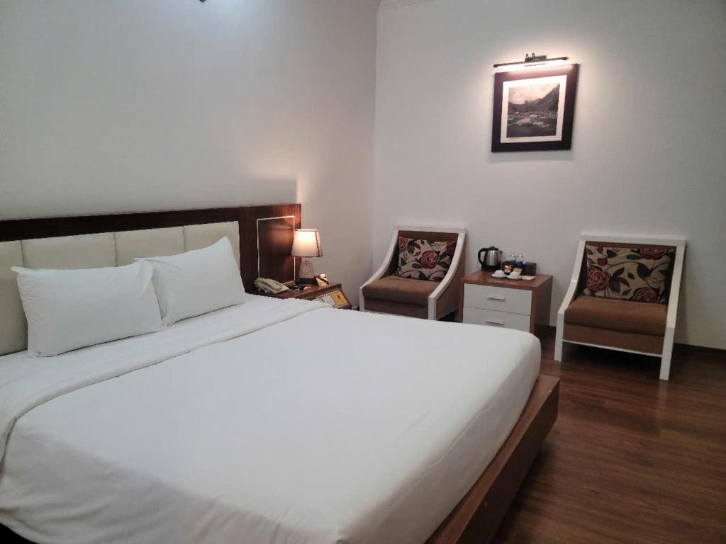 Postel nebo postele na pokoji v ubytování Luxor Boutique Hotel