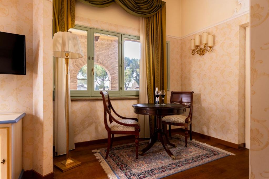 TV a/nebo společenská místnost v ubytování Relais Parco Dei Cavalieri Assisi
