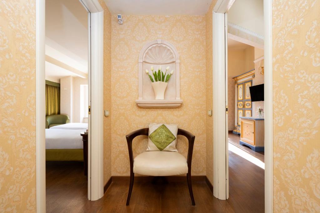 Postel nebo postele na pokoji v ubytování Relais Parco Dei Cavalieri Assisi